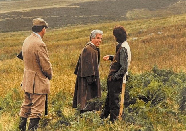 Jeffrey Epstein and two other men on a hillside.