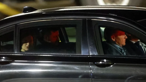 Ukrainian President Volodymyr Zelensky and his wife Olena Zelenska drive away from airport runway