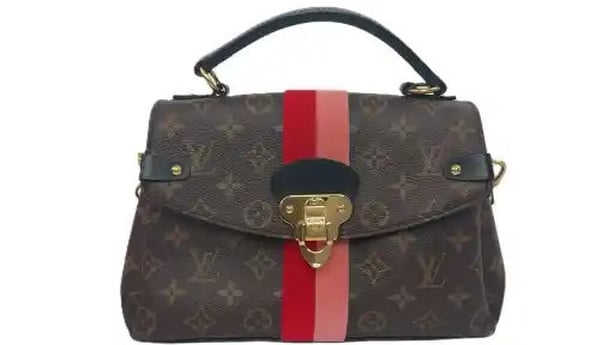 A louis vuitton handbag which went on auction is pictured