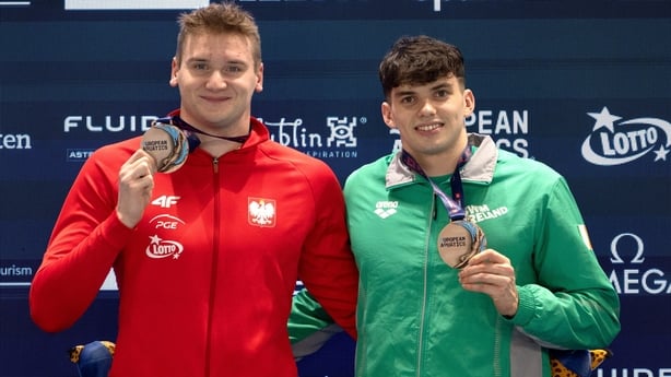 4 December 2025; Joint bronze medalists Evan Bailey of Ireland, right, and Kamil Sieradzki of Poland during the medal ceremony after the Men's 200m Freestyle final during day three of the European Short Course Swimming Championships at Lublin in Poland. Photo by Nikola Krstic/Sportsfile