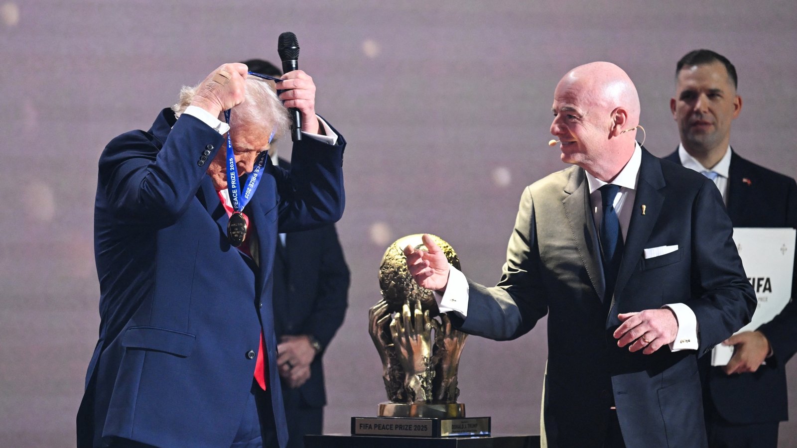 Trump given inaugural FIFA peace prize at World Cup draw