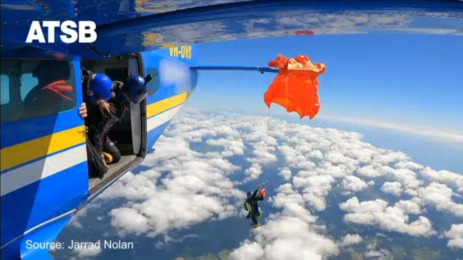 Moment skydiver left dangling on plane's tail