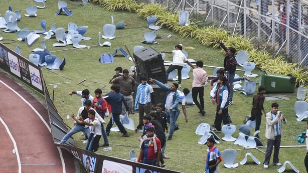 Clashes between fans and police are seen on the field during Lionel Messi's GOAT concert in Kolkata