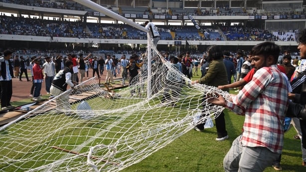 Clashes between fans and police are seen on the field during Lionel Messi's GOAT concert in Kolkata