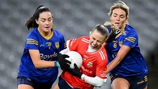 13 December 2025; Lynsey Noone of Kilkerrin-Clonberne in action against St Ergnat’s, Moneyglass players Rebecca Bradley, left, and Aoife Kelly during the AIB All-Ireland Ladies Football Club Senior Club Championship final match between Kilkerrin-Clonberne