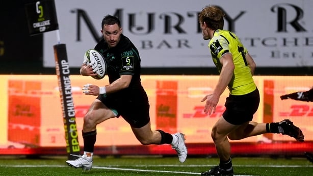 13 December 2025; Caolin Blade of Connacht on his way to scoring his side's seventh try despite the efforts of Luka Tsirekidze of Black Lion during the EPCR Challenge Cup match between Connacht and Black Lion at Dexcom Stadium in Galway. Photo by Tyler Miller/Sportsfile