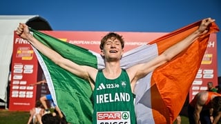 14 December 2025; Nick Griggs of Ireland celebrates winning the U23 men's race at the 2025 SPAR European Cross Country Championships in Lagoa, Portugal. Photo by Sam Barnes/Sportsfile