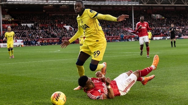 NOTTINGHAM, ENGLAND - DECEMBER 14: Nottingham Forest's Omari Hutchinson competing with Tottenham Hotspurs' Randal Kolo Muani during the Premier League match between Nottingham Forest and Tottenham Hotspur at City Ground on December 14, 2025 in Nottingham, England. (Photo by Andrew Kearns - CameraSpo