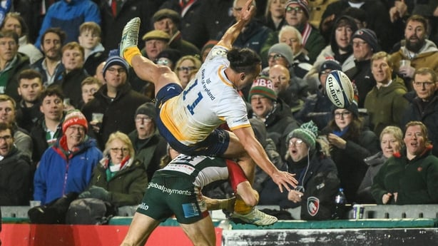 England , United Kingdom - 12 December 2025; James Lowe of Leinster is tackled by Adam Radwan of Leicester Tigers during the Investec Champions Cup match between Leicester Tigers and Leinster at Mattioli Woods Welford Road in Leicester, England. (Photo By Brendan Moran/Sportsfile via Getty Images)
