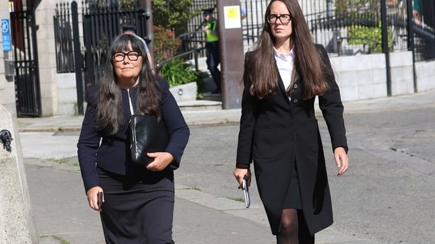 Martina Burke on the left walks alongside Ammi Burke