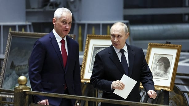 Russia's President Vladimir Putin and Defence Minister Andrei Belousov walk after an expanded meeting of the Russian Defence Ministry Board