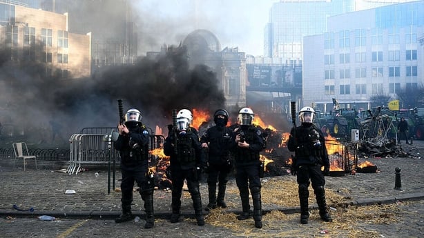 Police officers evacuate the Place du Luxembourg near the European Parliament