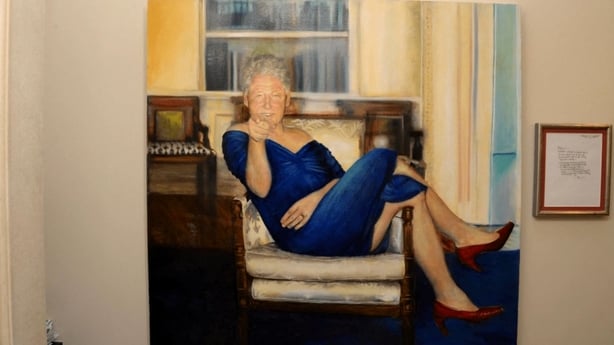 PHOTO SHOWS A PAINTING DEPICTING FORMER US PRESIDENT BILL CLINTON WEARING A BLUE DRESS