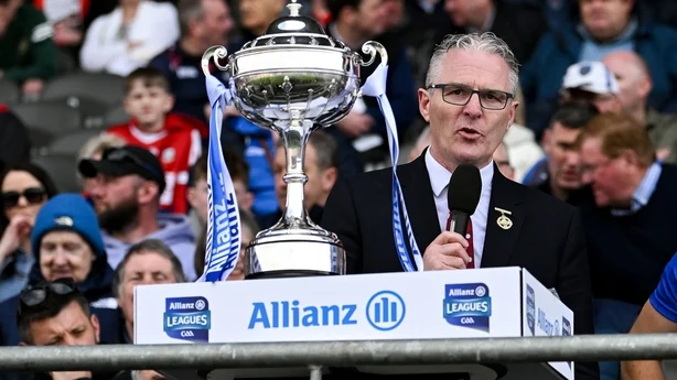 6 April 2025; Uachtarán Chumann Lúthchleas Gael Jarlath Burns, left, makes a speech in the company of Waterford captain Dessie Hutchinson and Allianz chief executive Geoff Sparling, after the Allianz Hurling League Division 1B final match between Waterford and Offaly at SuperValu Páirc Uí Chaoimh in