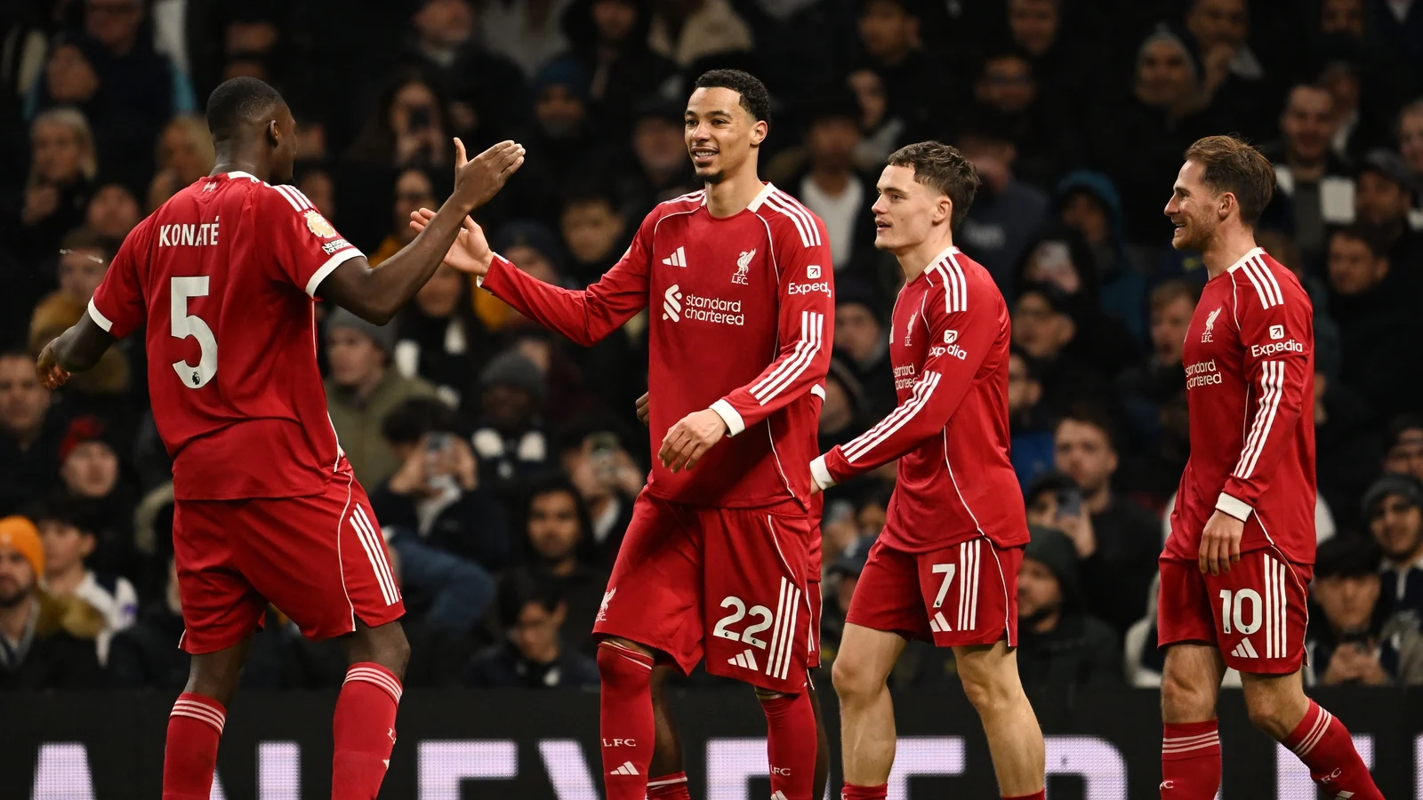 Liverpool hold on to beat nine-man Tottenham