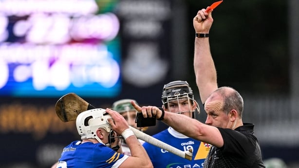 21 December 2025; Cullen Killeen of Loughrea is shown a red card by referee Johnny Murphy during the AIB GAA Hurling All-Ireland Senior Club Championship semi-final match between Loughrea of Galway and Slaughtneil of Derry at Parnell Park in Dublin. Photo by Ramsey Cardy/Sportsfile