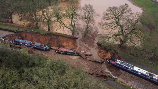 Several boats are seen stranded after a sinkhole opened at the canal in Shropshire