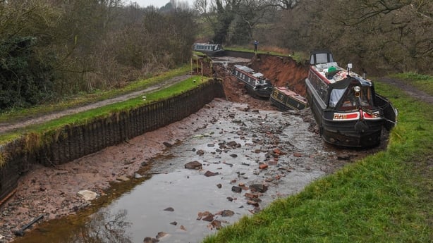 Several boats are seen stranded after a sinkhole opened at the canal in Shropshire