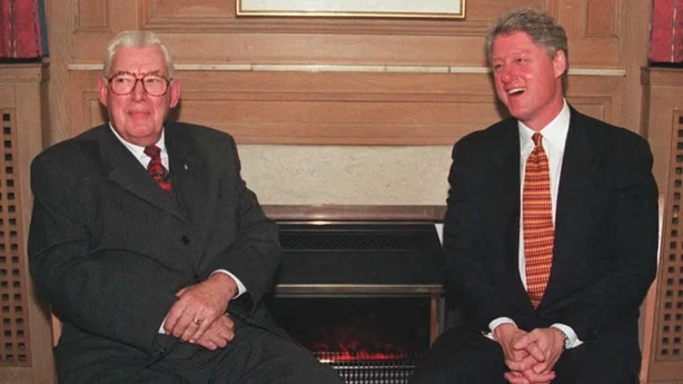 US President Clinton(R) poses 30 November with Democratic Unionist Party Leader Rev. Ian Paisley during a reception at Queen's University in Belfast. Clinton also met with Sinn Fein leader Gerry Adams during the same reception. President Clinton is the first US President to visit Northern Ireland. 