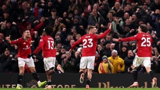 MANCHESTER, ENGLAND - DECEMBER 26: Patrick Dorgu of Manchester United ( 2nd L) celebrates with teammates (L-R) Diogo Dalot, Luke Shaw and Manuel Ugarte after scoring his team's first goal during the Premier League match between Manchester United and Newca