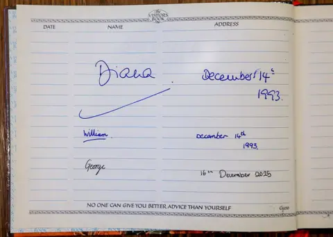 Andrew Parsons/Kensington Palace A page in the Passage visitors' book showing signatures from Diana and William in 1993, and George in 2025. 
