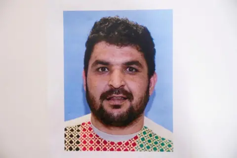 Reuters A picture of Rahmanullah Lakanwal, an Afghan national who is the suspect in the shooting of two National Guard members in DC.