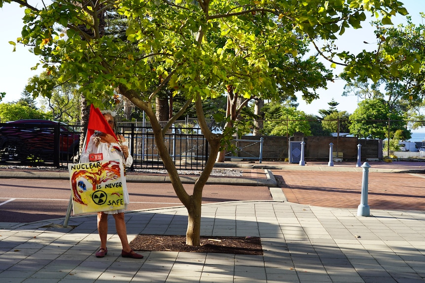 Sole anti-nuclear protestor outside an AUKUS community meeting in Rockingham in December