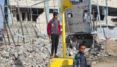 Displaced Palestinian families sheltering inside the UNRWA-run Malak School in Bani Suheila, east of Khan Younis, find themselves suddenly located within the newly designated "yellow line" after the Israeli army repositioned the yellow concrete blocks used to demarcate the so-called "temporary withdrawal line" inside Gaza, December 9, 2025. (Photo: Tariq Mohammad/APA Images)