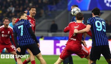 Florian Wirtz, right, has his shirt pulled by Alessandro Bastoni