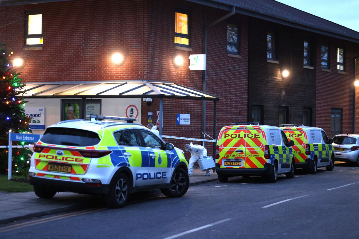 Police at Newton Community Hospital in Newton-le-Willows yesterday