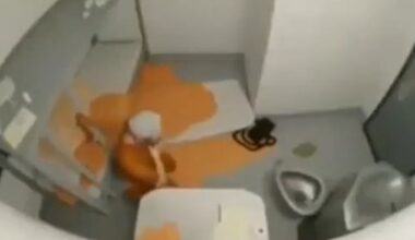The grainy, 12-second clip appeared to show a man wearing orange prison gear on the floor of his cell