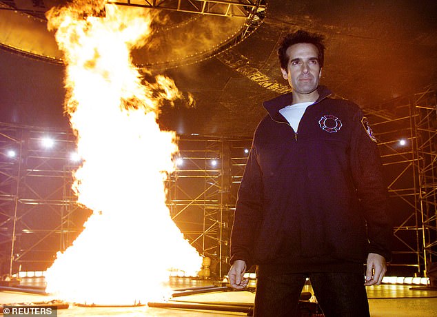 The famous illusionist and magician is pictured in front of a 'tornado of fire' on stage in New York in 2001