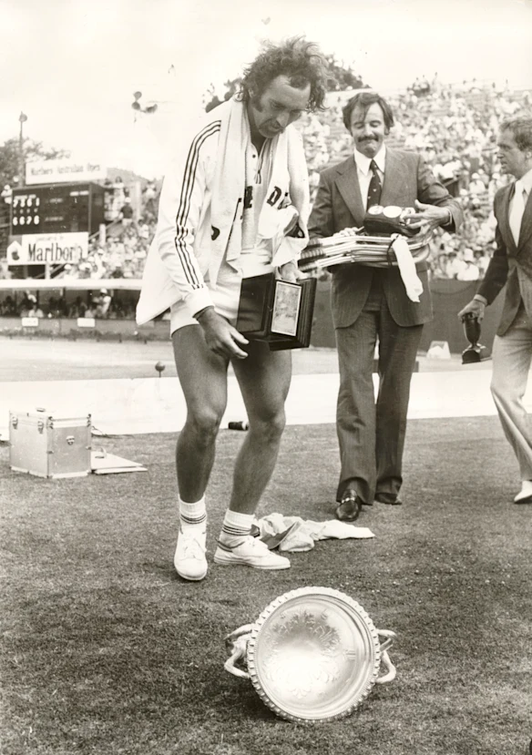 The trophy juggle becomes too much for the victorious Edmondson.