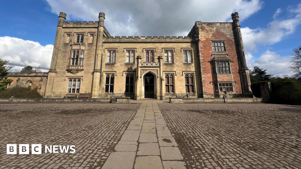 Georgian style castle infront of pebbled grounds