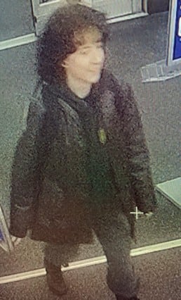 Person standing in doorway of store