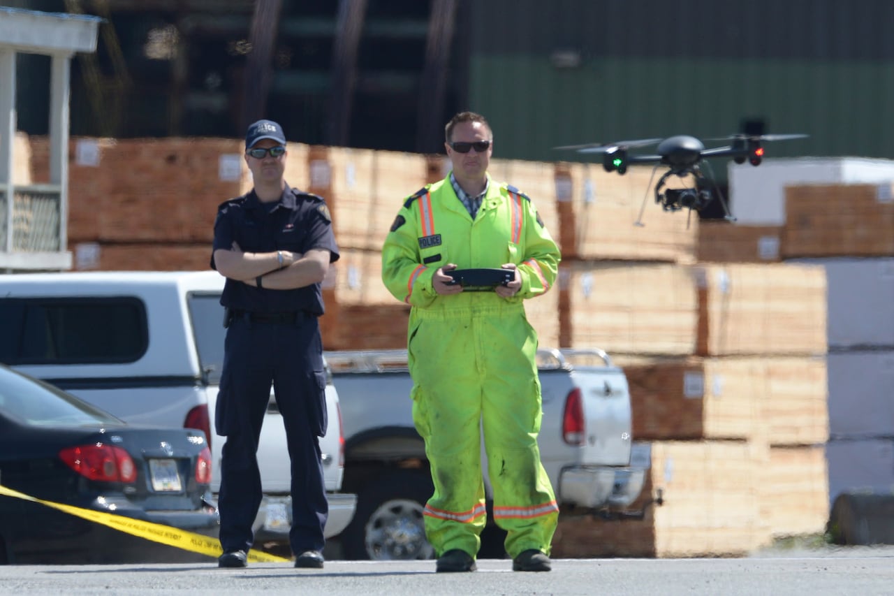 RCMP use a quadricopter drone to survey the crime scene at Western Forest Products mill in Nanaimo, B.C., on Wednesday, April 30, 2014.