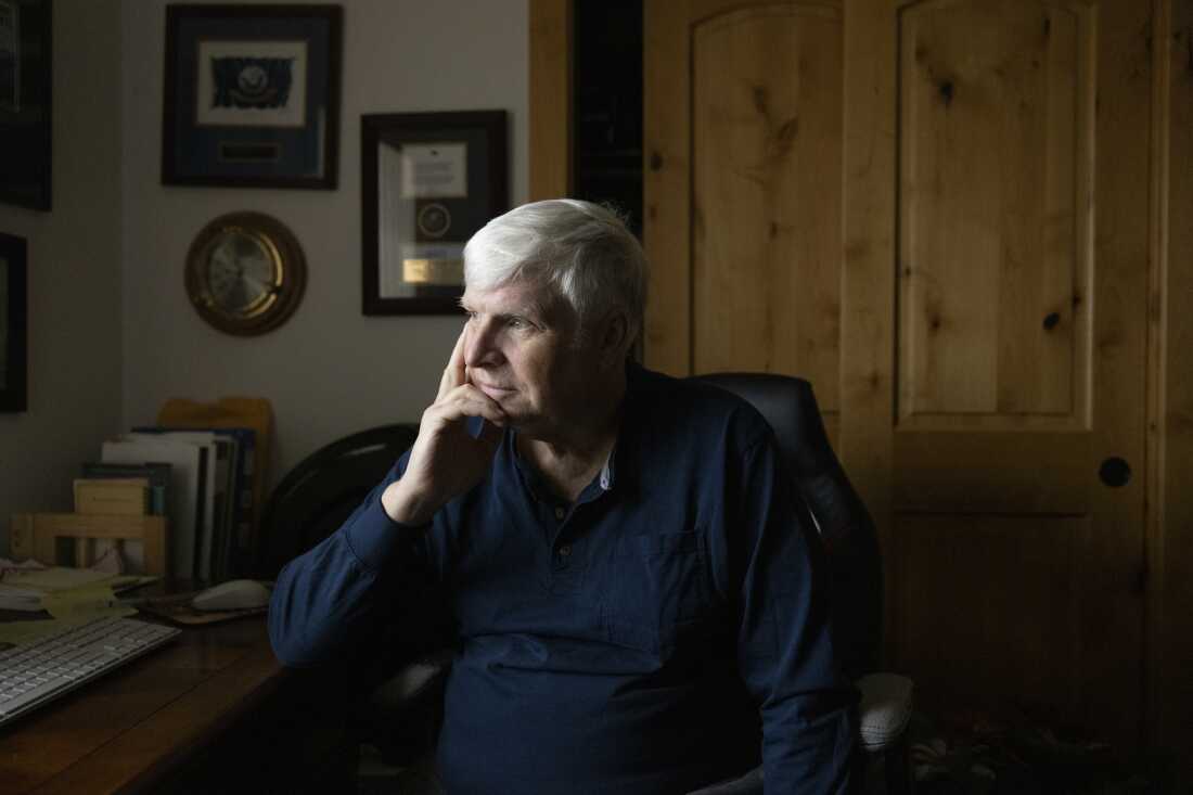 Erik Jensen, 66, is seen at his home in Warrenton, Ore. on Wednesday afternoon, Nov. 5, 2025. Jensen served in the Navy for 30 years before retiring in 2007. After falling in love with scuba diving while stationed in Guam, his Navy service eventually included deep-sea diving which took an incredible physical toll on his body. While veterans are entitled to free support from accredited services to navigate their healthcare benefits, Jensen sought out the services of Trajector Medical. Jensen assumed he would be getting a quality service for what he was paying, which was costly help to navigate increasing his veteran benefits. In the end, he was charged and paid $12,000 for a service that could have been provided to him for free. Kristina Barker for NPR