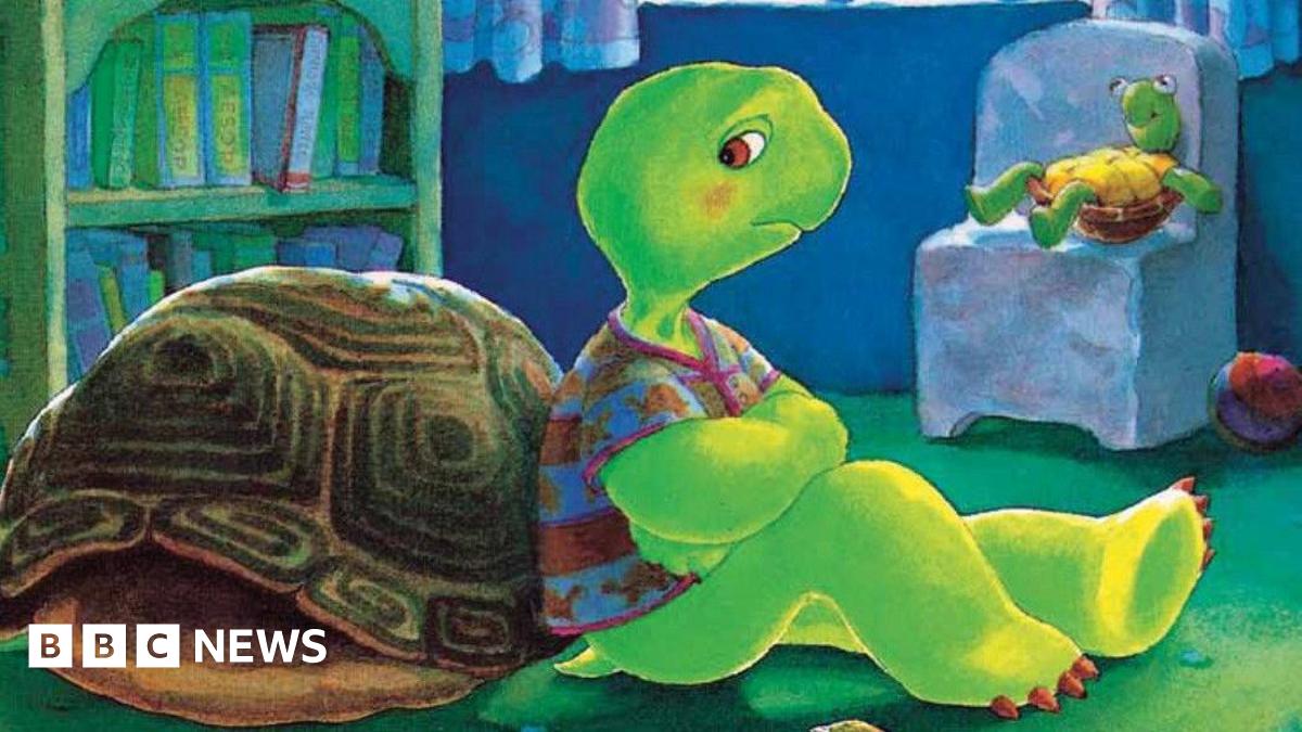 A cartoon image of Franklin the Turtle leaning against his shell, wearing a T-shirt in his bedroom and looking sad.