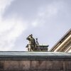 A sniper is seen on a roof as police secures the venue of a meeting of European Union leaders at Christiansborg Palace in Copenhagen, Denmark, on Wednesday.