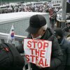 A supporter of impeached South Korean President Yoon Suk Yeol holds a placard reading "Stop the Steal" as he takes part in a rally near Yoon's residence in Seoul on Sunday.