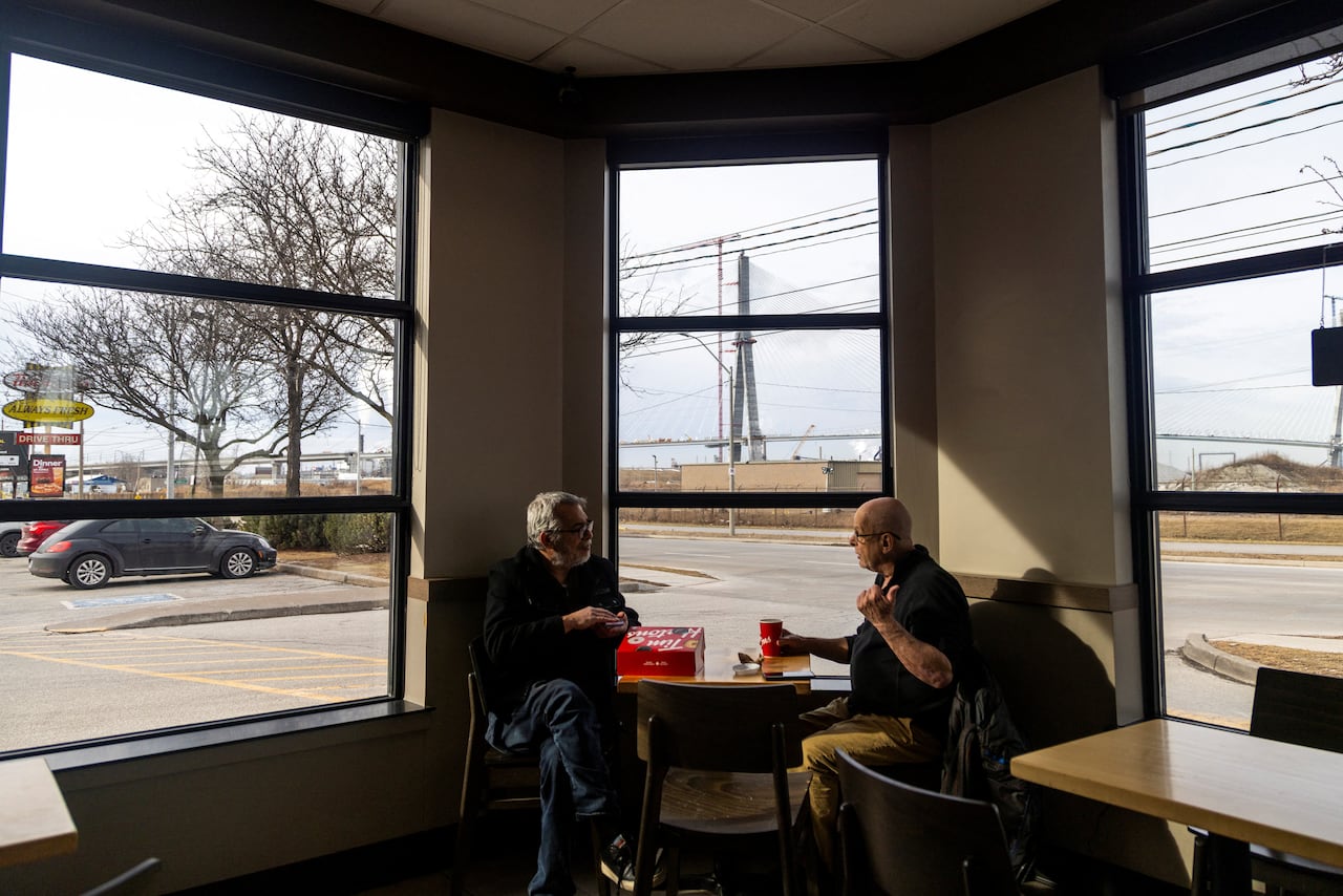 Two men at a restaurant. 