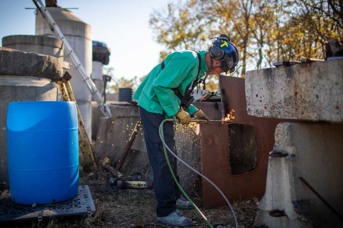 Grant Light demonstrates how to use a torch to cut through steel.