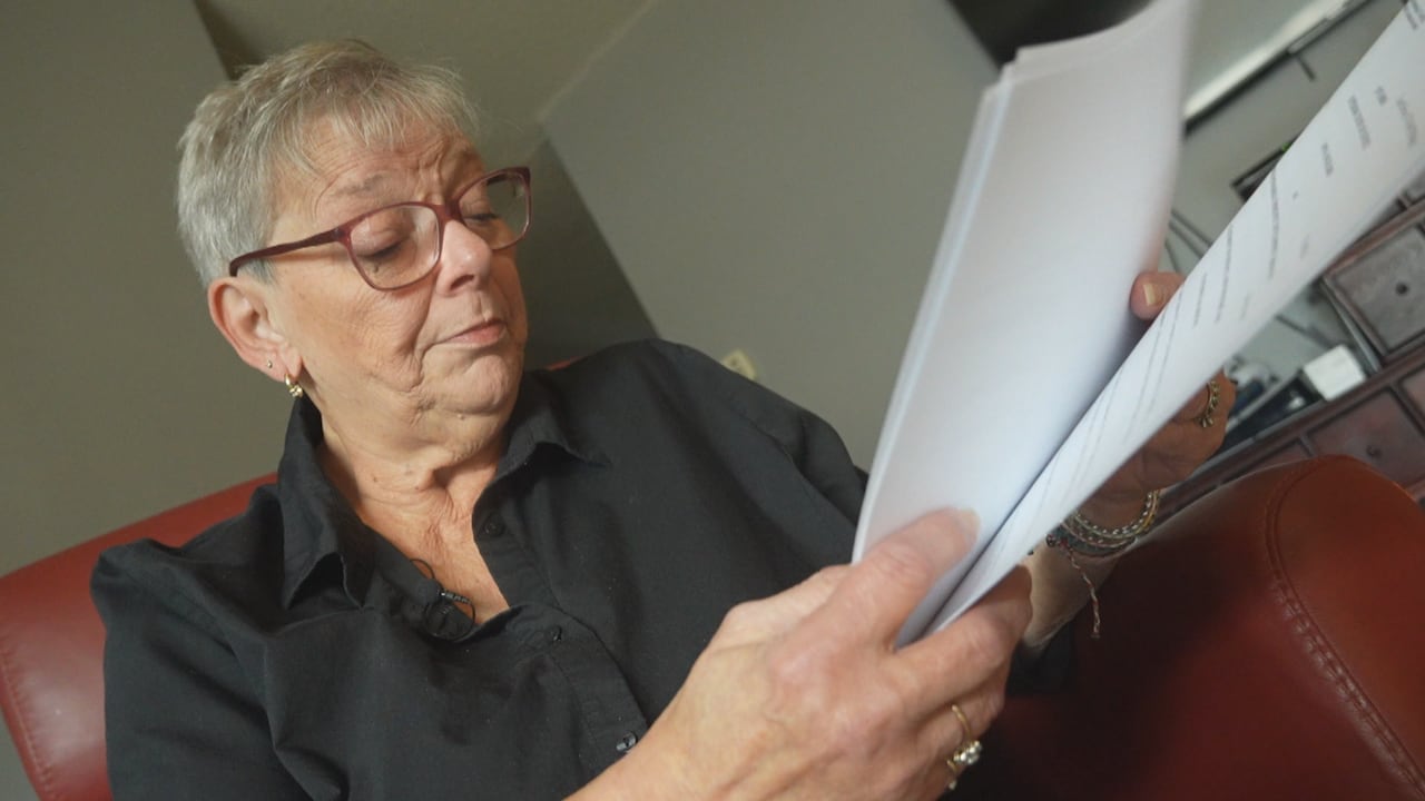 A woman with papers in her hands