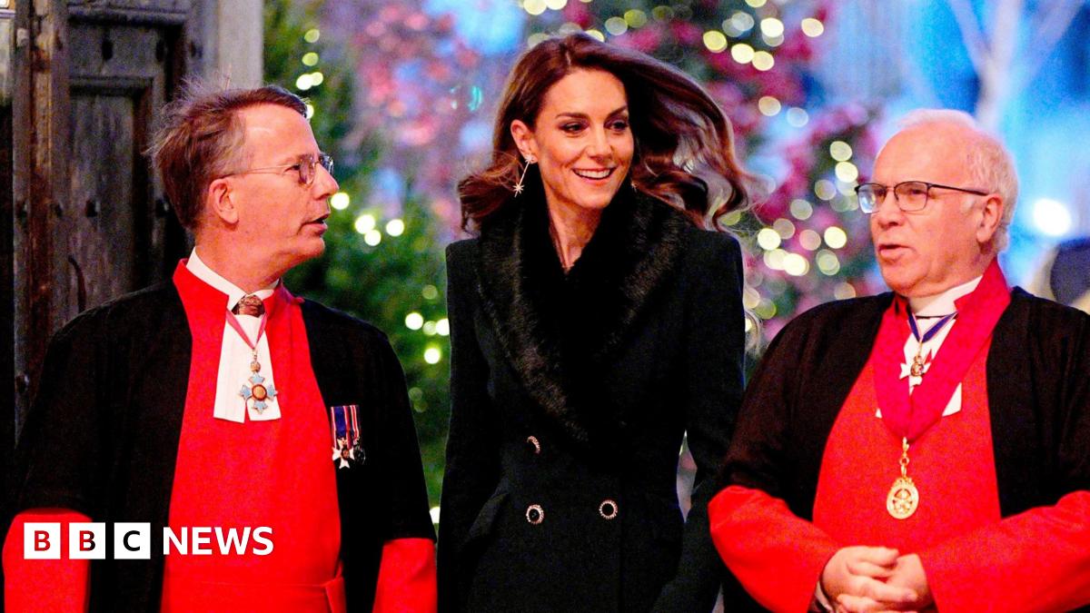 Prince William, Prince George and Prince Louis are seen walking outside the Abbey wearing suits, shirts and ties, while their sister Charlotte, wearing a dress with a peter pan collar, looks up at their mother Catherine, who wears a green coat with a furry collar