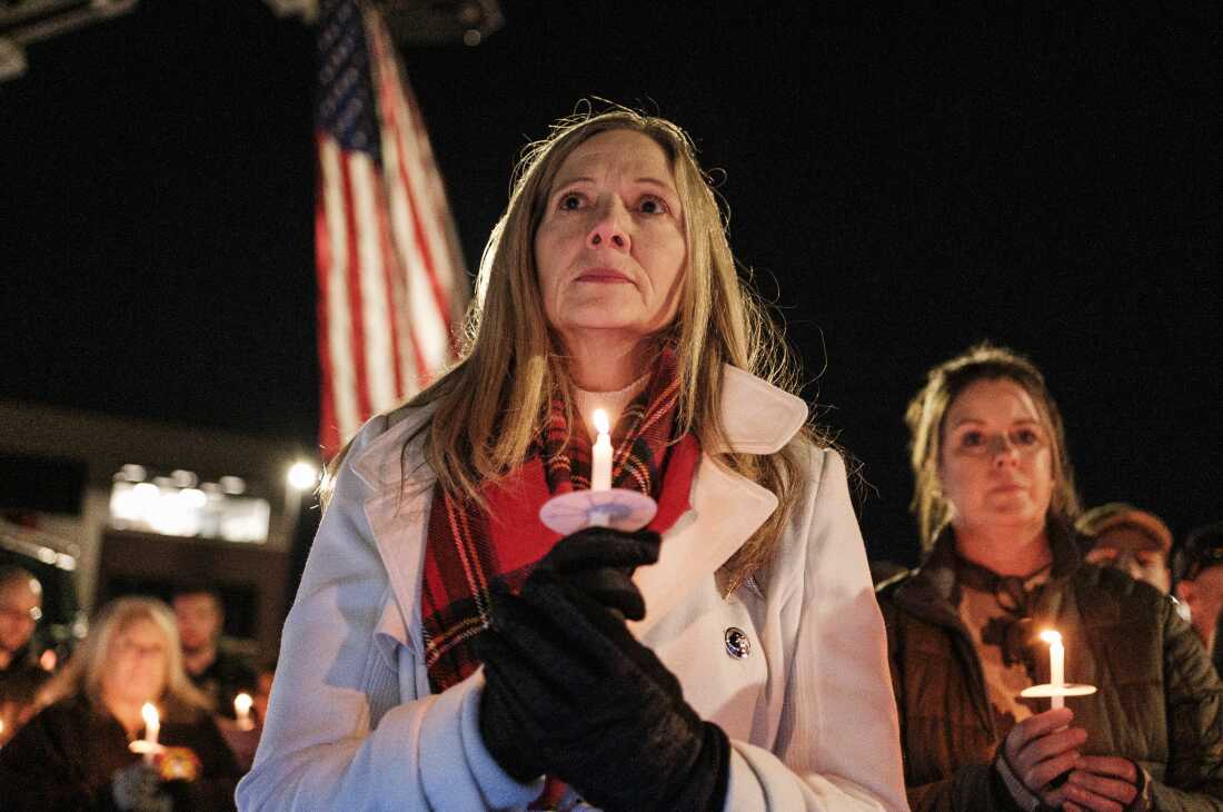 Members of the West Virginia Public Safety community attend a candlelight vigil for SSgt Andrew Wolfe outside of the Berkley County Sheriff Office on December 3.