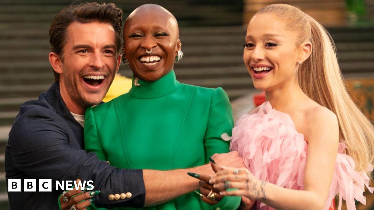 Wicked: For Good stars Jonathan Bailey, Cynthia Erivo, Ariana Grande laughing and hugging