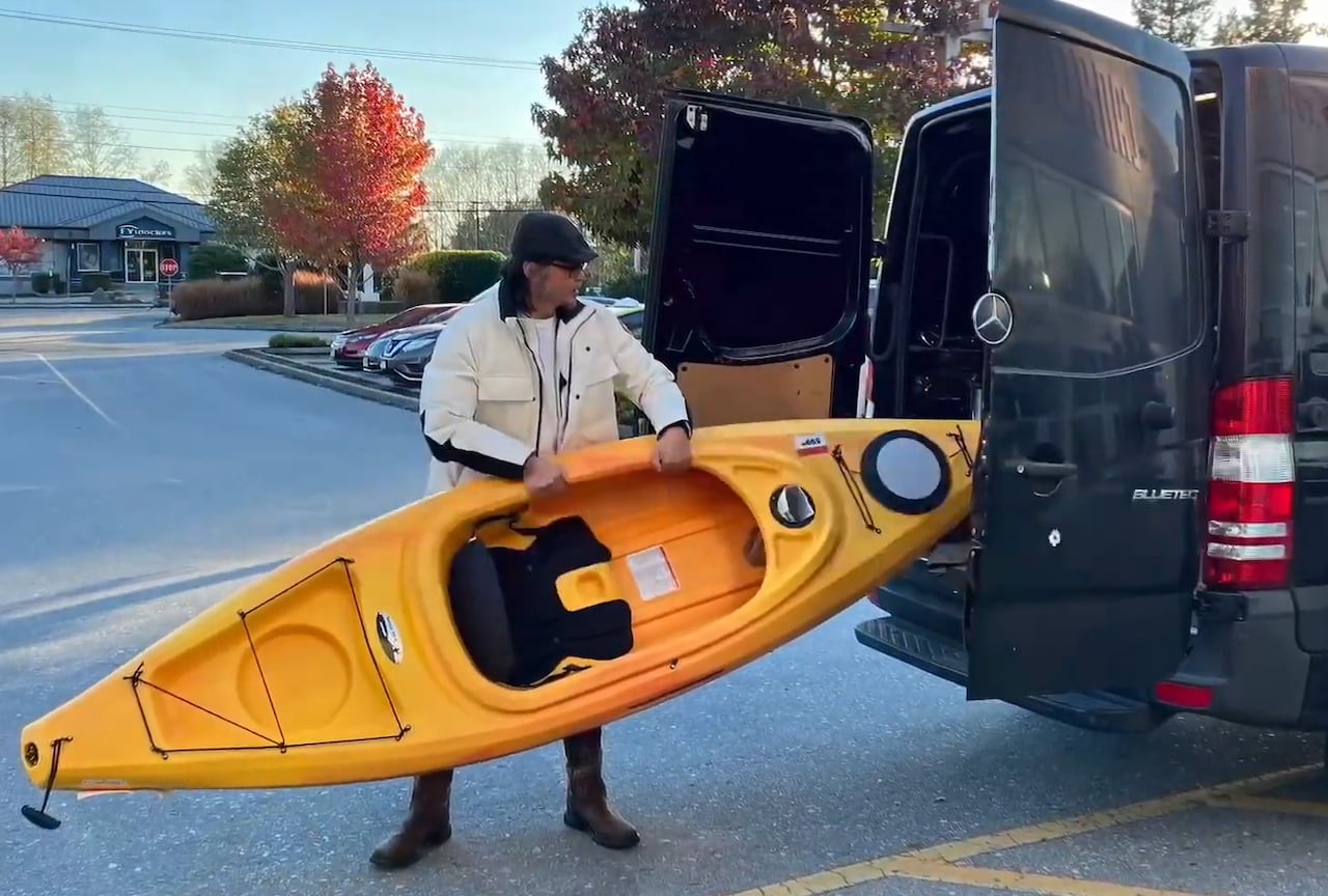 Chinese political dissident Hua Yong is seen with his newly purchased kayak in November 2022, shortly before he died while kayaking in B.C.