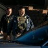Federal law enforcement agents outside a metro Denver apartment complex during an immigration raid Feb. 5, 2025