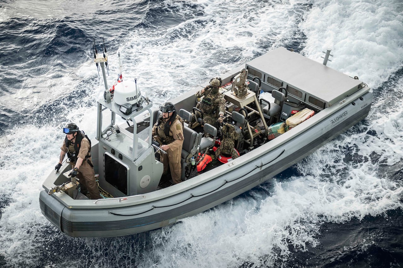 People in a speed boat.