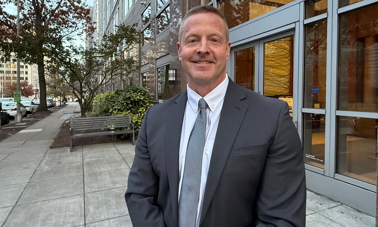 Photo of Bob Wahlin on a street in front of a building